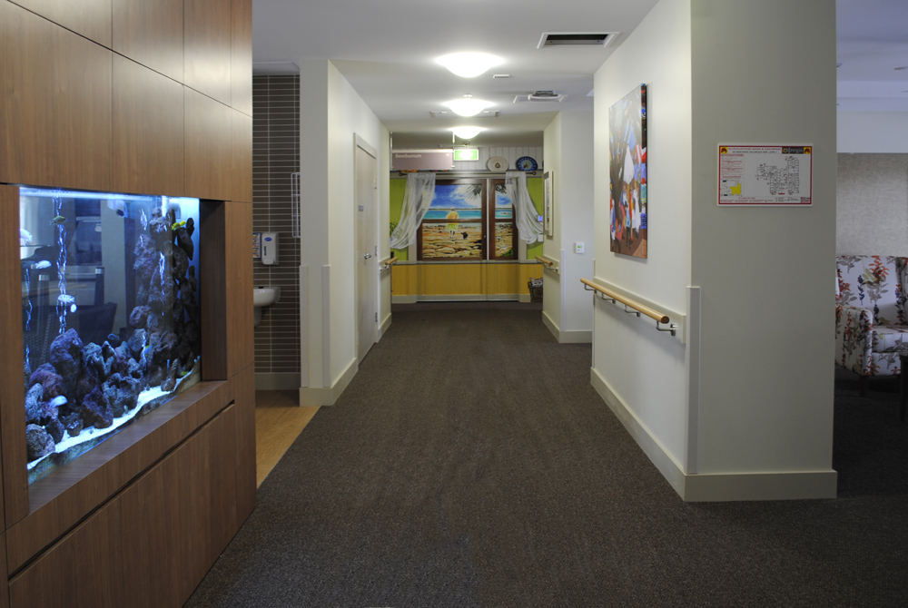 dementia mural seen from a distance in a corridor